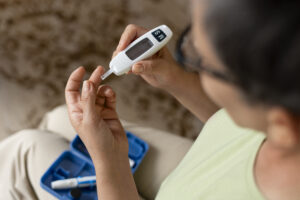 high-angle-diabetic-woman-checking-her-glucose-level